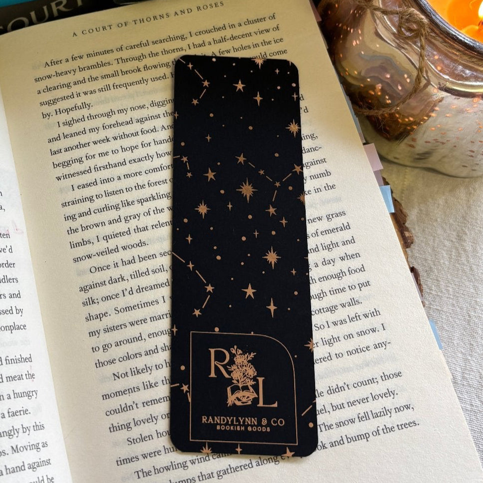 backside of bookmark is laid out on a page of an open book