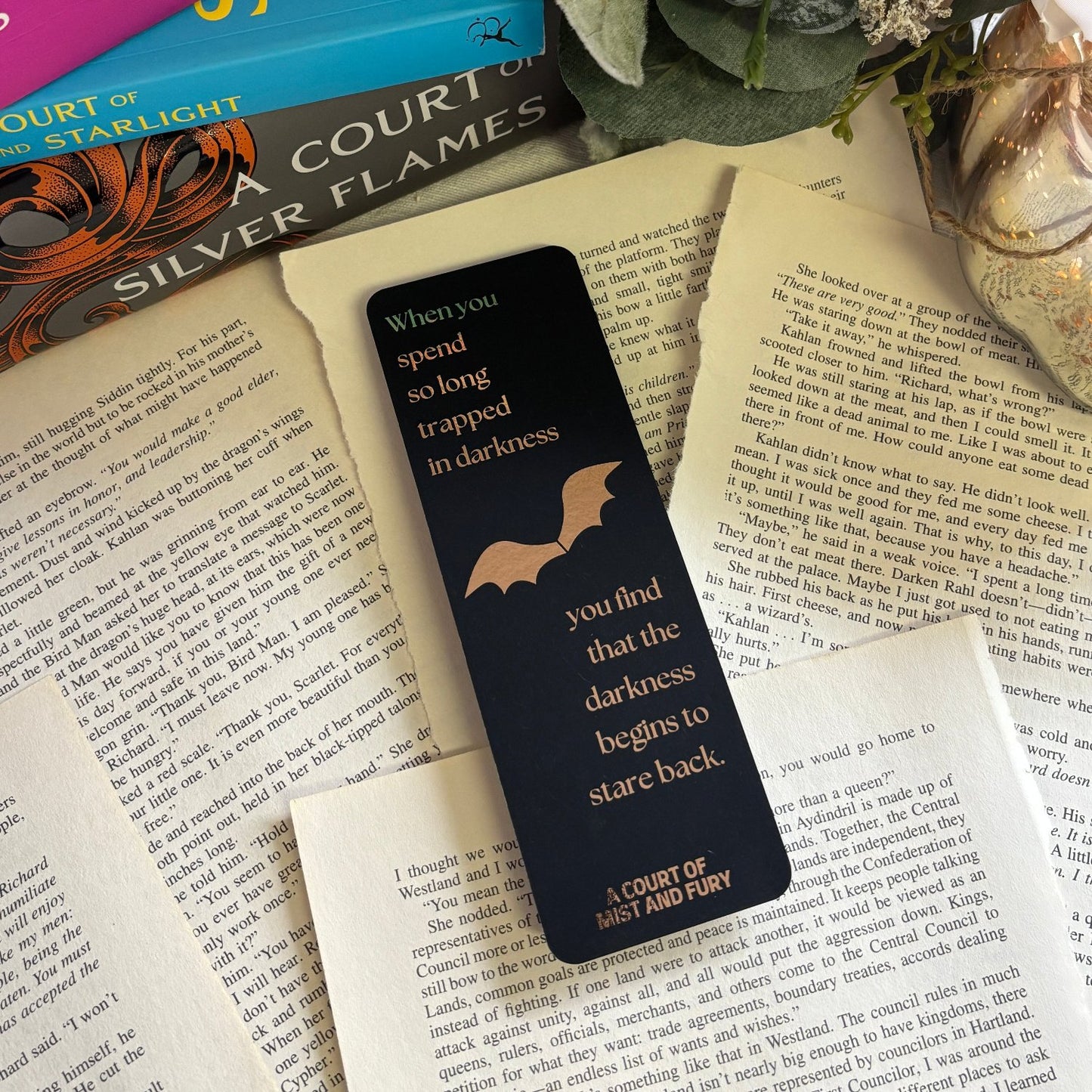 bookmark is laid out on torn out book pages