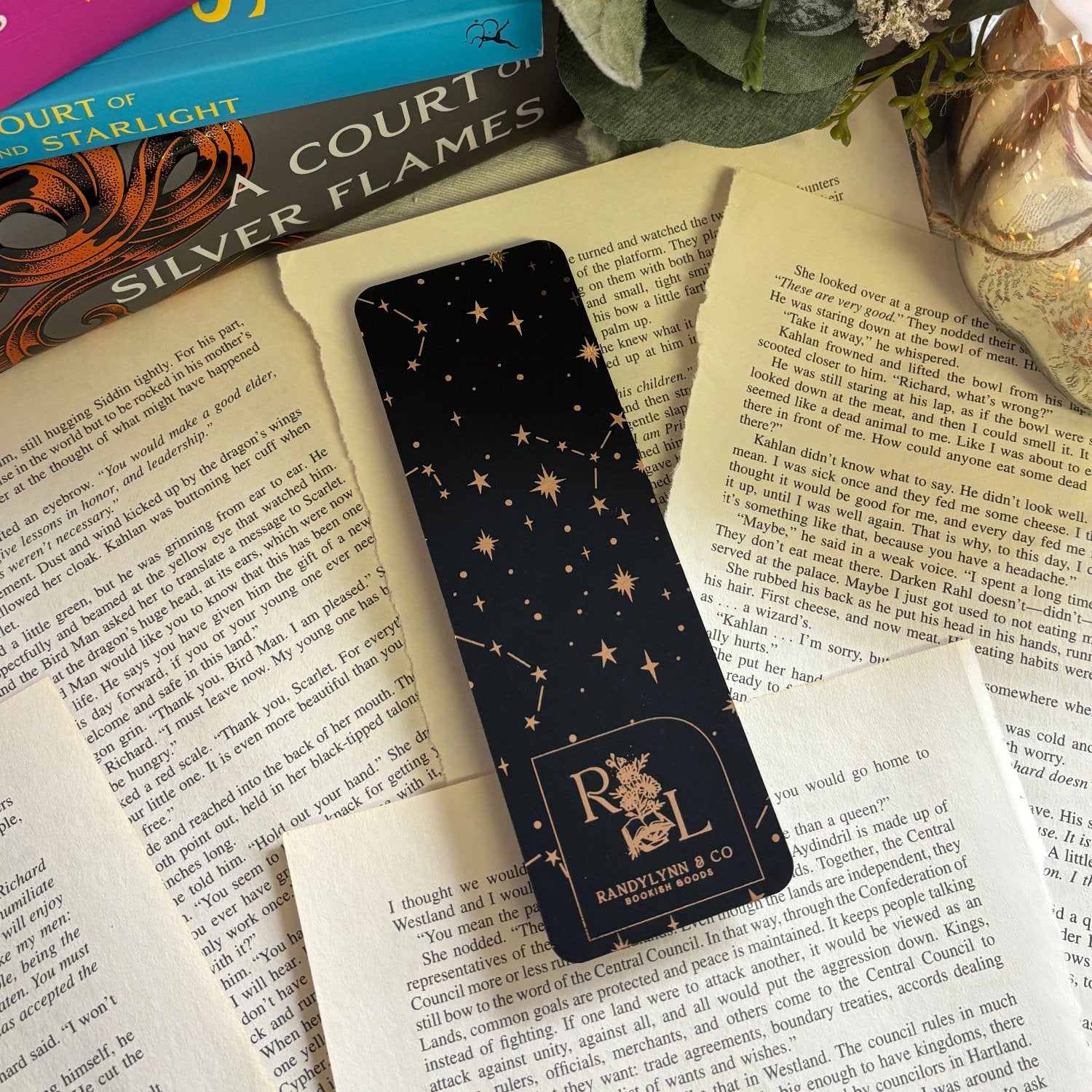 backside of bookmark is laid out on torn out book pages