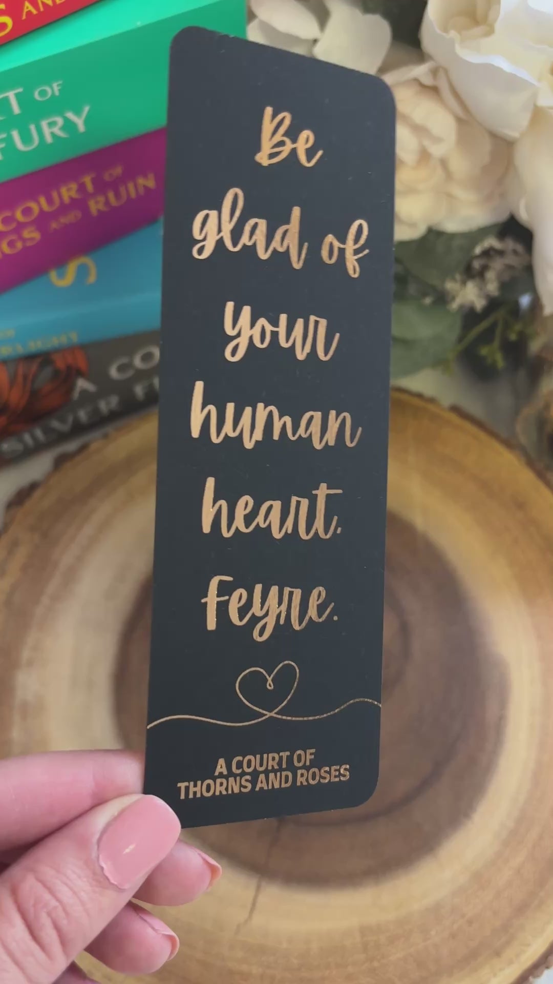 video showing the sheen of the rose gold foil. displays the front and back of the bookmark